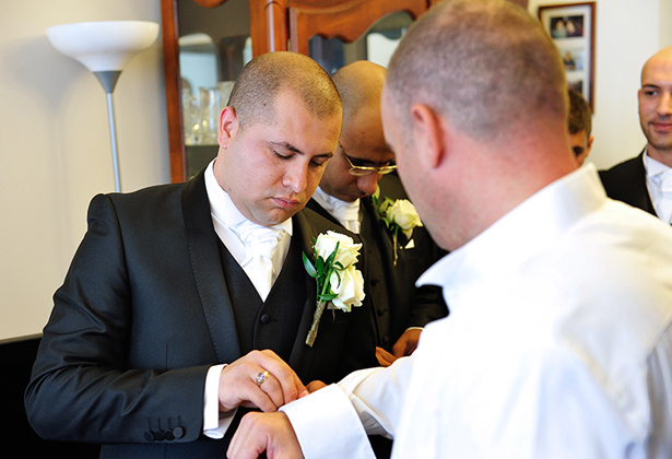 Grooms taking part in Greek wedding traditions 2