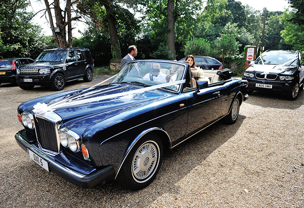 Bride arriving in vintage car