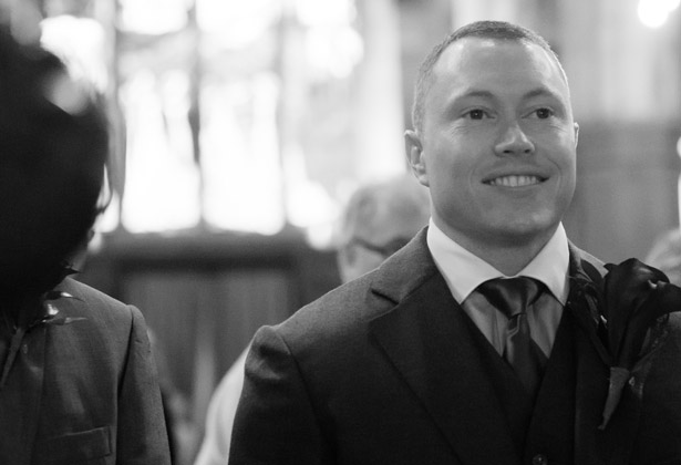 Groom waiting at the alter