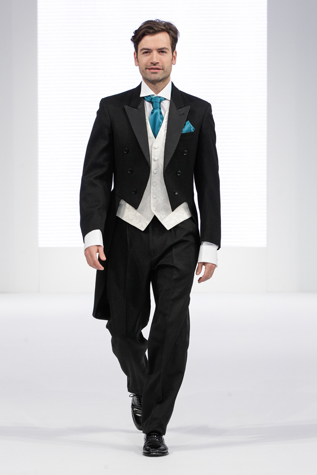 Classic designer menswear tails for the groom with turquoise cravat 