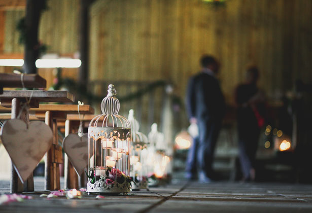 Bird cage, candles and rose petal aisle decoration 