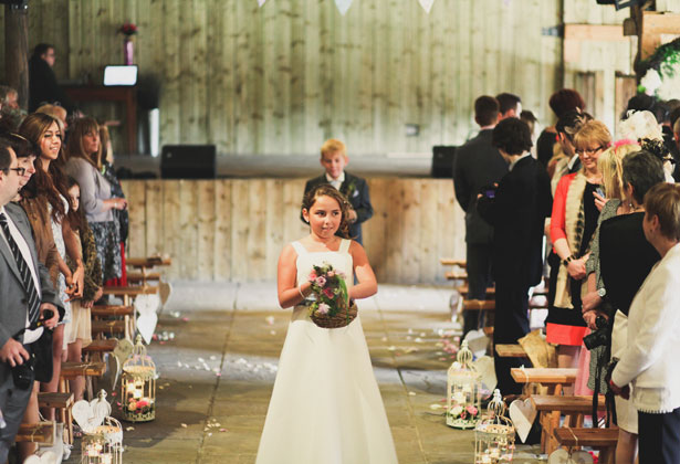 Bridesmaid and page boy walking down the aisle 