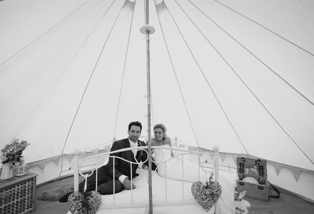 The bride and groom in a tipi by Sansom Photography 