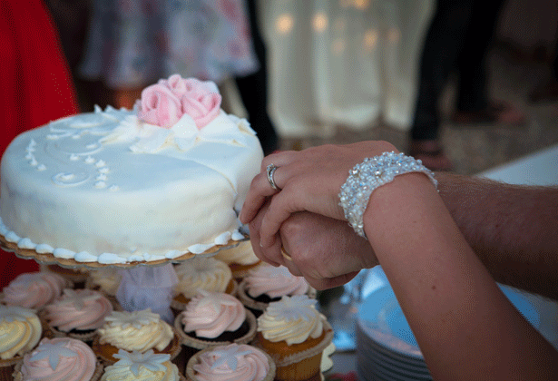 Bride and groom cutting the wedding cake 