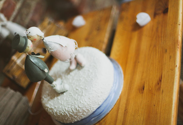 White wedding cake with blue ribbon 