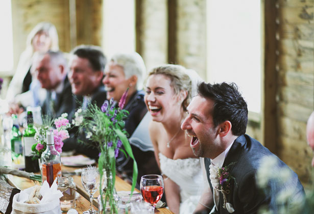 Bride and groom enjoying the speeches