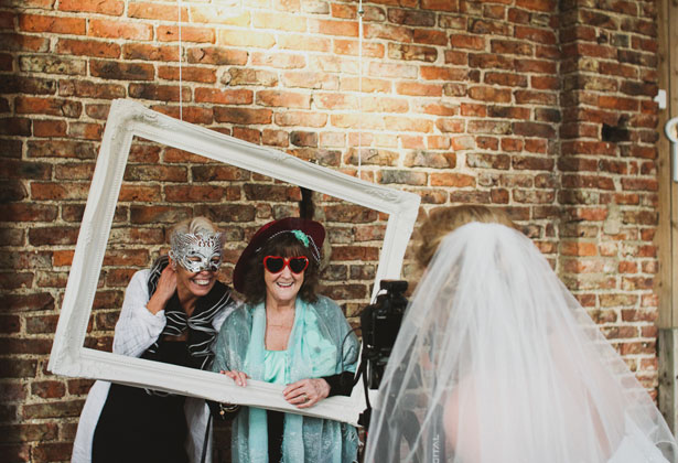 Bride taking a picture of her guests