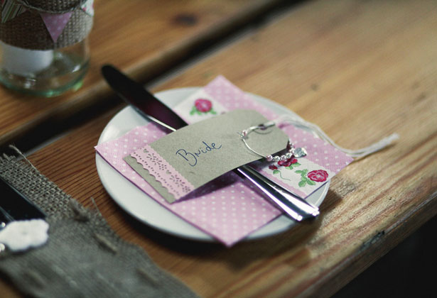 Rustic place card and pink floral napkins 