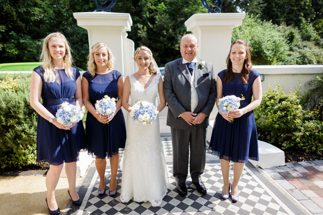 The bride with her father and her bridesmaids    