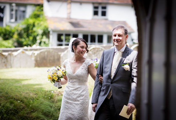 Bride with her father making their entrance in to the church 