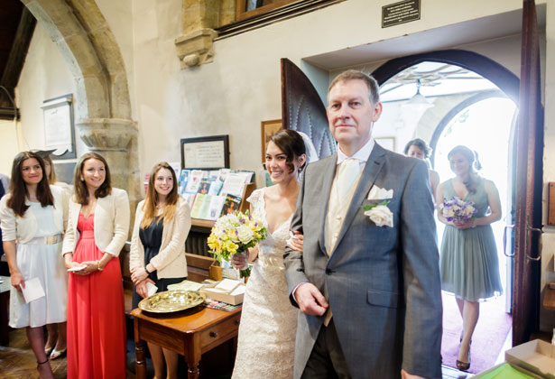 Bride with her father making their entrance in to the church 