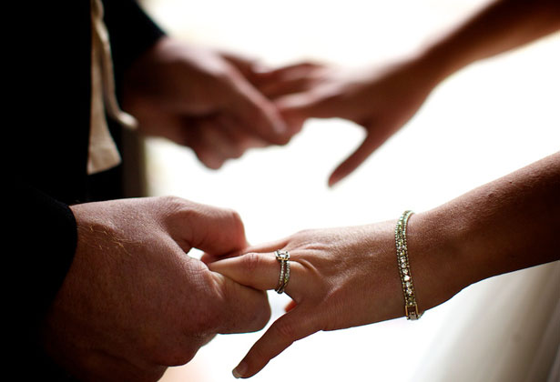 Bride and groom holding hands 