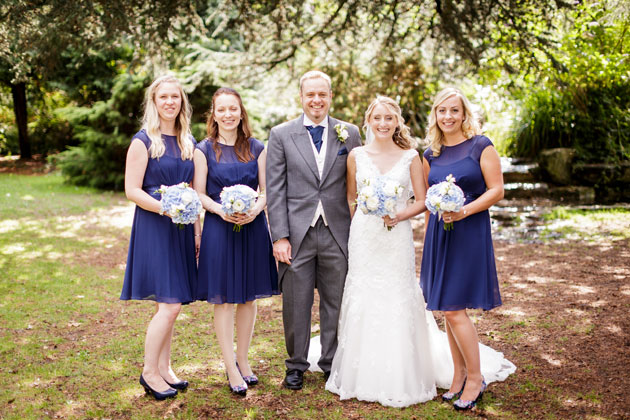 The bride and groom with their bridesmaids by Douglas Fry Photography