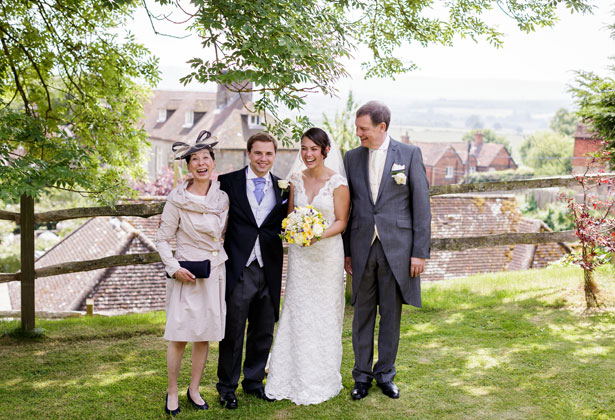 The newlyweds with the bride’s parents by Douglas Fry Photography 