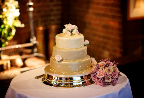 Champagne coloured wedding cake with rose details 