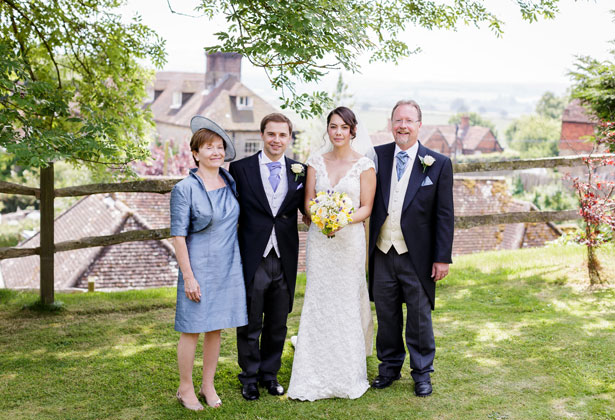 The newlyweds with the groom’s parents by Douglas Fry Photography