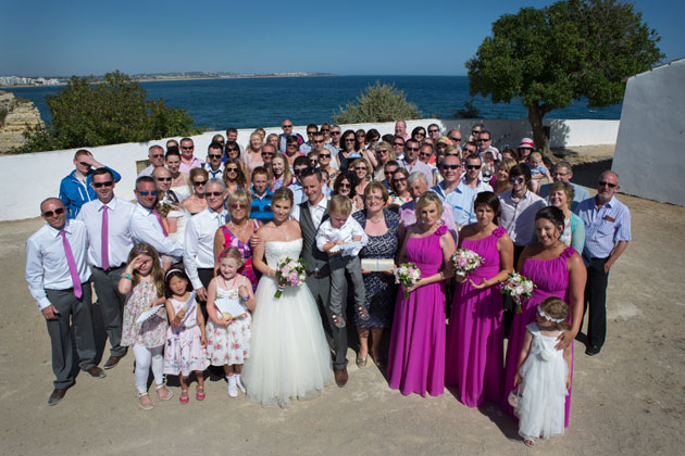 The newlyweds with their family and friends