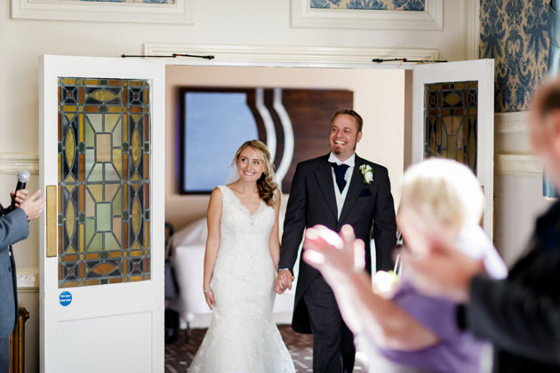 Bride and groom entering the reception 