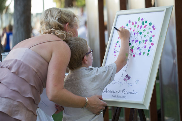 Guests filling in the personalised finger print tree 