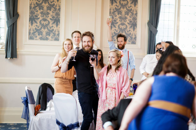 Guests toasting the happy couple 