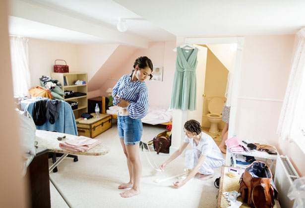  Bridesmaid helping bride get ready 