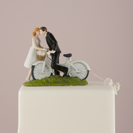 "A Kiss Above" Bicycle Bride and Groom Couple Figurine - Pretty Bicycle Wedding Cake Topper | Confetti.co.uk