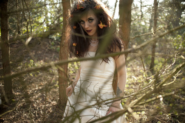 Zombie bride in the woods with flowers in her hair by Halo and Hobby