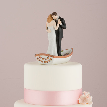 "Row Away" Wedding Couple In a Rowboat Figurine - Wedding Cake Topper Ideas | Confetti.co.uk