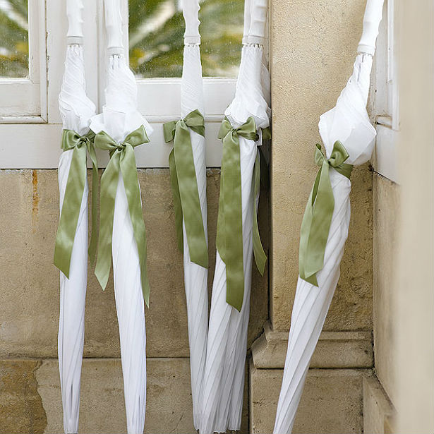 Bridal umbrellas with green ribbon at Confetti