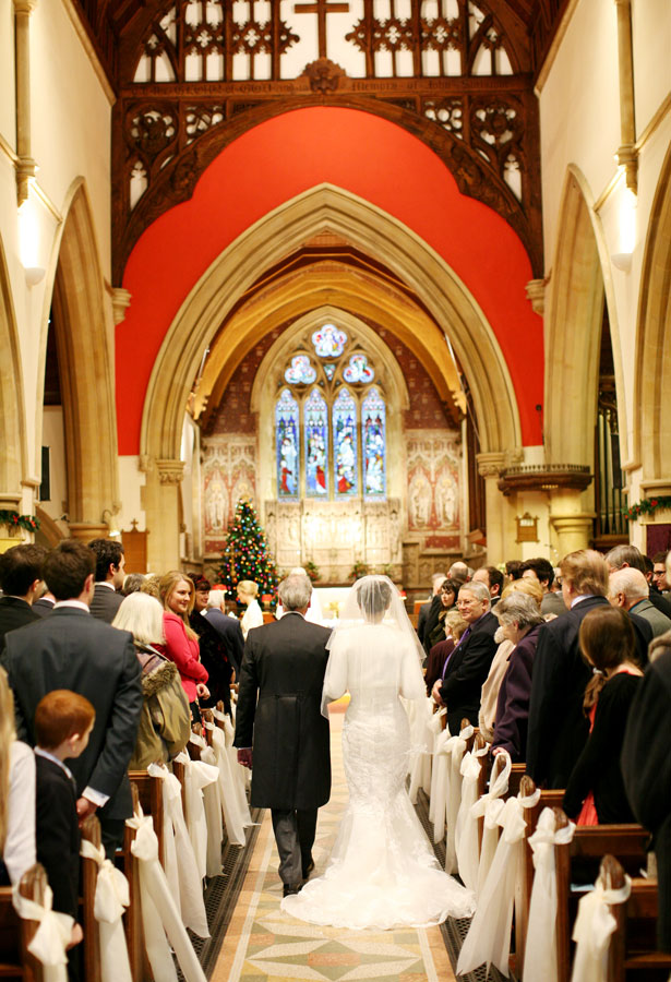 Bride walking down the aisle with her father       