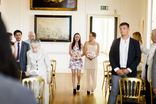 The bridesmaids walking down the aisle 