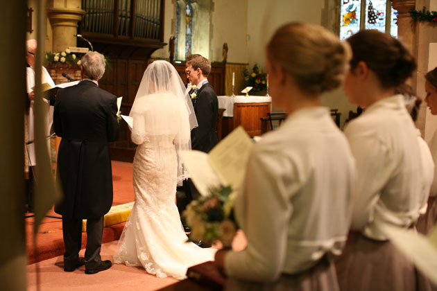 The bride and groom at the alter