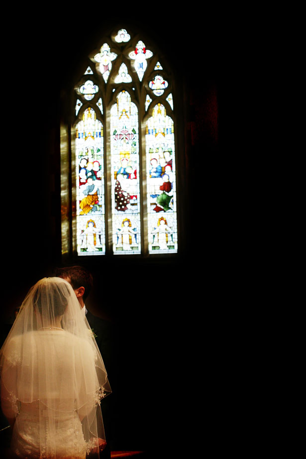 The bride and groom at the alter 