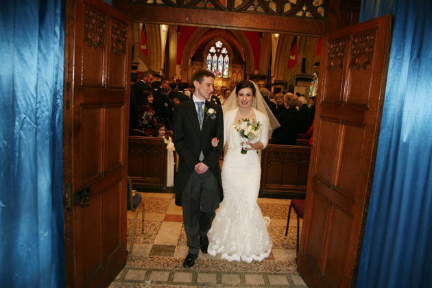 The happy couple leaving the church 