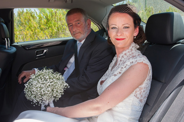 The bride and her father in the wedding car      