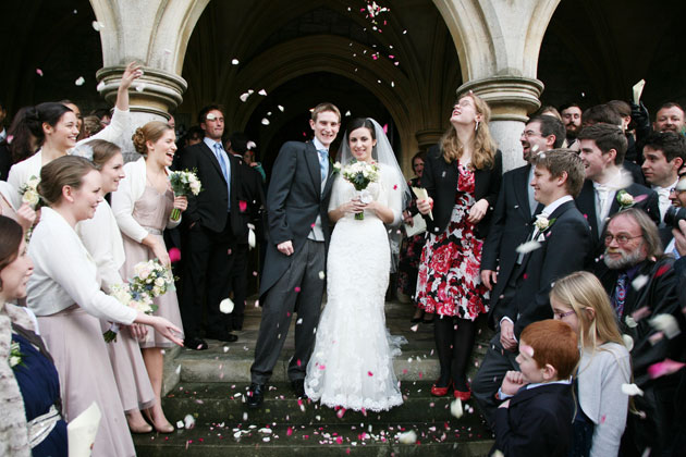 Wedding guests throwing confetti to celebrate the marriage