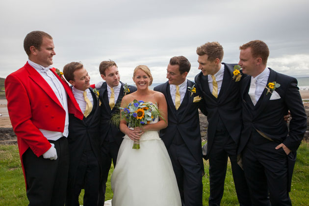 The happy couple with the groomsmen 