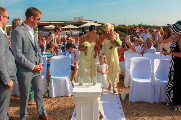 Bridesmaids in yellow strapless dresses from Forever Yours  