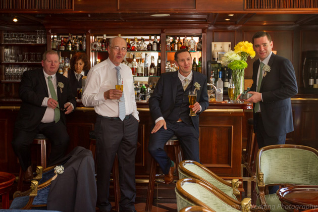 The groom with his best man and groomsman in the pub 