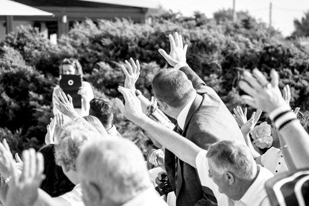 Guests waving to the photographer 