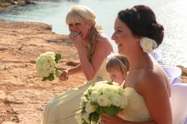 The bridesmaids enjoying the wedding ceremony 