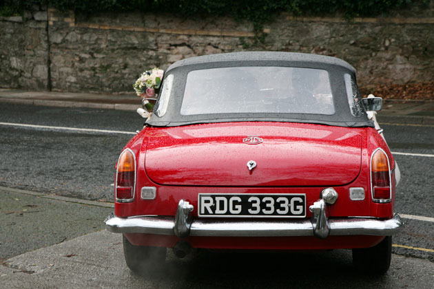 Vintage red MG wedding car 