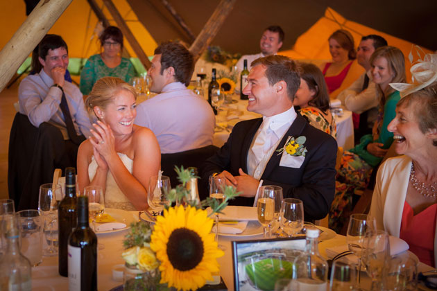 The newlyweds enjoying the speeches 