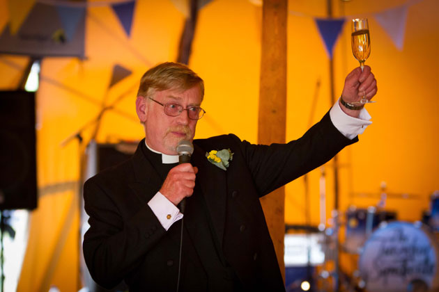 The father of the bride toasting the happy couple 