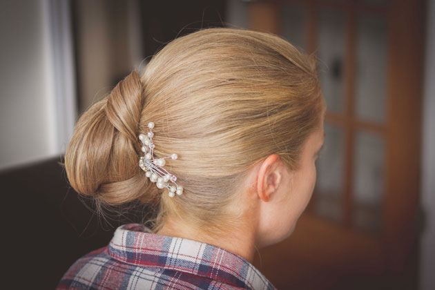 Bridal side hair do with pearl hair piece  