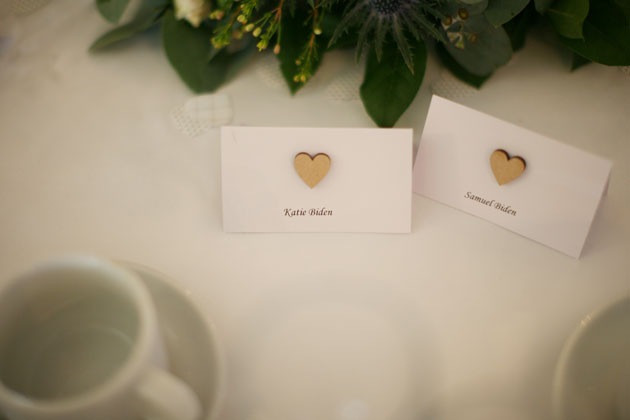 Place cards with gold hearts   