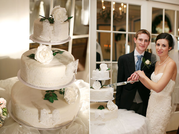 Bride and groom cutting their white lace wedding cake 