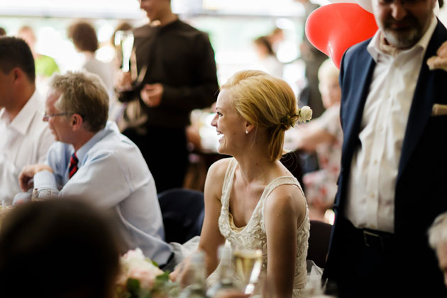 Bride enjoying the meal with her wedding guests 