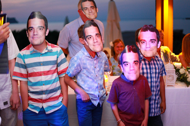 Brides nephews in Robbie William masks 