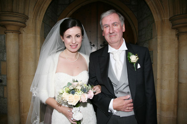 Bride with her father at entrance to the church